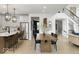 Open-concept dining room with view into the kitchen and staircase to second level at 1452 E Greyhound E Pass, Carmel, IN 46032