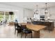 Bright kitchen with center island and modern appliances open to the dining and living areas at 1452 E Greyhound E Pass, Carmel, IN 46032