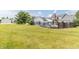 Large backyard with a swimming pool and black metal fence surrounding the home at 1595 N 400 W, Greenfield, IN 46140