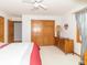 Bright bedroom featuring wood doors, a fan, a light wood dresser and a window at 1595 N 400 W, Greenfield, IN 46140