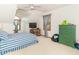Bright bedroom featuring vaulted ceilings, a striped comforter and a green dresser at 1595 N 400 W, Greenfield, IN 46140