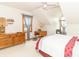 Bright bedroom featuring natural light, a wooden dresser, and decoratively styled furniture at 1595 N 400 W, Greenfield, IN 46140