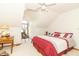 Bright bedroom with vaulted ceilings and a window nook, featuring a white and red comforter at 1595 N 400 W, Greenfield, IN 46140