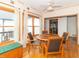 Inviting dining area with hardwood floors, a ceiling fan, and lots of natural light at 1595 N 400 W, Greenfield, IN 46140