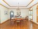 Elegant dining room featuring hardwood floors, a chandelier, and natural light at 1595 N 400 W, Greenfield, IN 46140