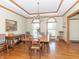 Well-lit dining room with hardwood floors, classic furnishings, and natural light at 1595 N 400 W, Greenfield, IN 46140