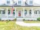 Charming home featuring white columns, a cozy front porch, and a beautifully landscaped yard at 1595 N 400 W, Greenfield, IN 46140