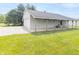 A side view of the detached two car garage showing the covered porch area and door at 1595 N 400 W, Greenfield, IN 46140