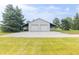 An eye-level view of the detached two car garage showing the covered lean-to area at 1595 N 400 W, Greenfield, IN 46140