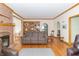 Inviting living room with a fireplace, hardwood floors, and open layout leading to other rooms at 1595 N 400 W, Greenfield, IN 46140
