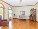 Bright living room with hardwood floors, arched windows, and classic furnishings at 1595 N 400 W, Greenfield, IN 46140