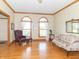 Bright and spacious living room featuring hardwood floors and arched windows at 1595 N 400 W, Greenfield, IN 46140