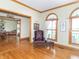 Cozy living area with hardwood floors, arched windows, and comfortable seating at 1595 N 400 W, Greenfield, IN 46140