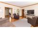 Cozy living room with hardwood floors, neutral paint, and an open floor plan at 1595 N 400 W, Greenfield, IN 46140