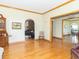 Spacious living area showcasing hardwood floors and access to other rooms at 1595 N 400 W, Greenfield, IN 46140
