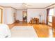 Spacious main bedroom showcasing wood floors, natural light, and versatile layout with sitting area at 1595 N 400 W, Greenfield, IN 46140