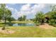 Picturesque pond with a fountain, green surroundings, and a covered bridge at 1595 N 400 W, Greenfield, IN 46140