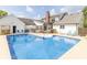 View of the pool with an outdoor bar, patio furniture, and back exterior of the home at 1595 N 400 W, Greenfield, IN 46140