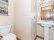 Convenient powder room featuring a toilet and pedestal sink at 1595 N 400 W, Greenfield, IN 46140