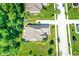 Aerial view of home and neighborhood showing mature landscaping and street view at 1631 Caspian Dr, Carmel, IN 46032