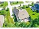 Aerial view of home highlighting the back patio, landscaping, and surrounding trees at 1631 Caspian Dr, Carmel, IN 46032