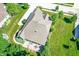 Aerial view showcasing well-kept yard and back patio, surrounded by trees at 1631 Caspian Dr, Carmel, IN 46032