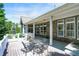 Back porch, perfect for relaxation and outdoor enjoyment, featuring a table, chairs, and grill at 1631 Caspian Dr, Carmel, IN 46032