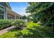 Spacious, green backyard with lush foliage, well-manicured landscaping, and a patio at 1631 Caspian Dr, Carmel, IN 46032