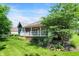 Landscaped backyard featuring a spacious deck perfect for outdoor entertaining and relaxation at 1631 Caspian Dr, Carmel, IN 46032