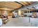 Spacious unfinished basement with exposed beams and a concrete floor offers great potential at 1631 Caspian Dr, Carmel, IN 46032