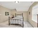 This carpeted bedroom is brightly lit and features a large window and comfortable furnishings at 1631 Caspian Dr, Carmel, IN 46032