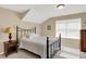Cozy bedroom features a large window, carpeted floor, and comfortable furnishings at 1631 Caspian Dr, Carmel, IN 46032