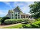 Exterior with large windows, a well-manicured lawn, and attractive landscaping at 1631 Caspian Dr, Carmel, IN 46032