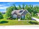 Charming brick home featuring beautiful landscaping, a well-manicured lawn, and inviting curb appeal at 1631 Caspian Dr, Carmel, IN 46032