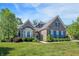 Charming brick home featuring beautiful landscaping, a well-manicured lawn, and inviting curb appeal at 1631 Caspian Dr, Carmel, IN 46032
