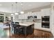 Spacious kitchen with large island, stainless appliances, white cabinetry, and hardwood floors at 1631 Caspian Dr, Carmel, IN 46032