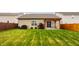 Backyard view of the home featuring a pergola, grill, and nice lawn space at 17183 Petersfield Ln, Westfield, IN 46074