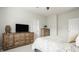Bedroom with rustic wood furnishings, neutral walls, and a comfortable bed at 17183 Petersfield Ln, Westfield, IN 46074