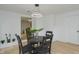 Dining area with view into sitting room with plant and black dining room set at 1740 Haynes Ave, Indianapolis, IN 46240
