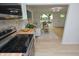 Updated kitchen with stainless steel appliances and open view to living room at 1740 Haynes Ave, Indianapolis, IN 46240