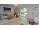 Bright living room with laminate floors and large windows at 1740 Haynes Ave, Indianapolis, IN 46240