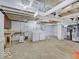 Unfinished basement area including laundry area and utility hookups at 1908 W Northgate St, Indianapolis, IN 46228