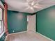 Carpeted bedroom featuring a ceiling fan, and a view to the kitchen at 1908 W Northgate St, Indianapolis, IN 46228