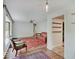 Open-concept living room featuring hardwood floors, a vintage rug, and vintage furniture at 1908 W Northgate St, Indianapolis, IN 46228