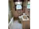 Bathroom featuring a patterned floor, tiled walls, shower with curtain, and vanity at 2211 Rosedale Dr, Indianapolis, IN 46227