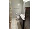 Modern bathroom featuring neutral paint, updated vanity, and a shower with decorative curtain at 2211 Rosedale Dr, Indianapolis, IN 46227