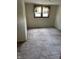 Bedroom featuring paneled walls and carpeted floor at 2211 Rosedale Dr, Indianapolis, IN 46227