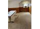 Attic bedroom with neutral carpet and wooden paneling at 2211 Rosedale Dr, Indianapolis, IN 46227