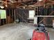Garage with a red lawn mower inside at 2211 Rosedale Dr, Indianapolis, IN 46227