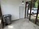 Enclosed patio with lighting and door entrance to the backyard at 2211 Rosedale Dr, Indianapolis, IN 46227